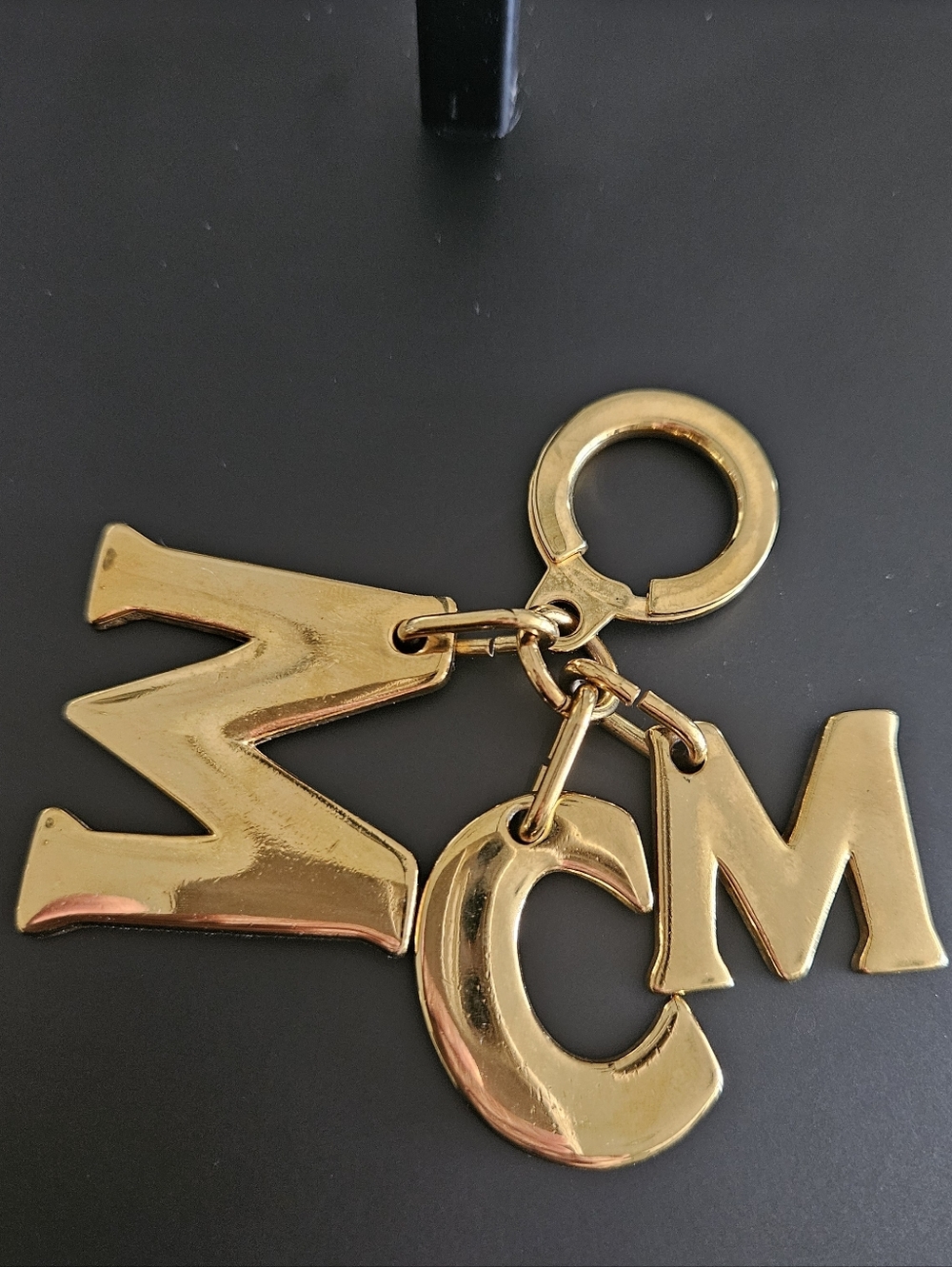 MCM Metal Logo Charm Key Ring | Gold Tone Designer Keychain | Luxury Accessory